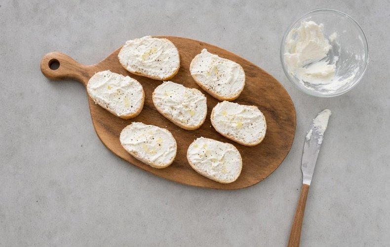 Salami and Olive Canapés, step 5: cream cheese spread on the bread slices