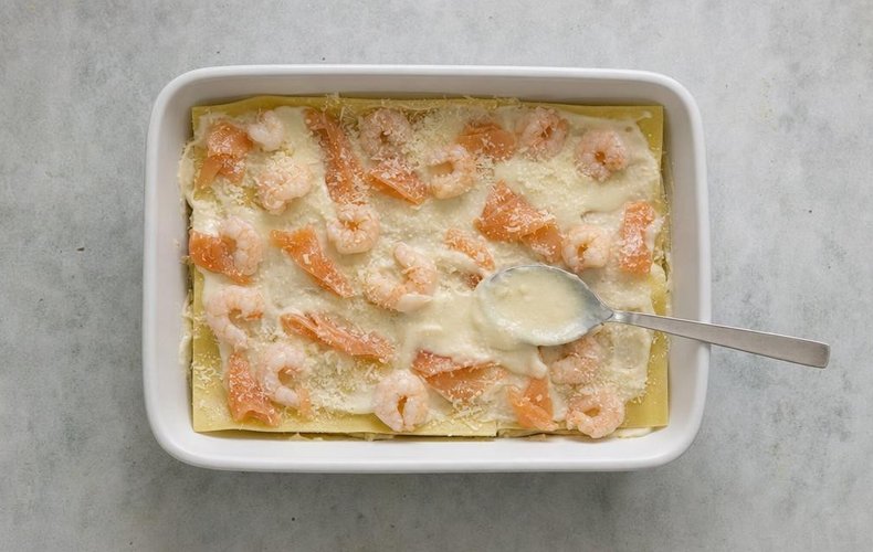 Salmon and Shrimp Lasagna, step 8: layering pasta, béchamel, salmon and shrimp