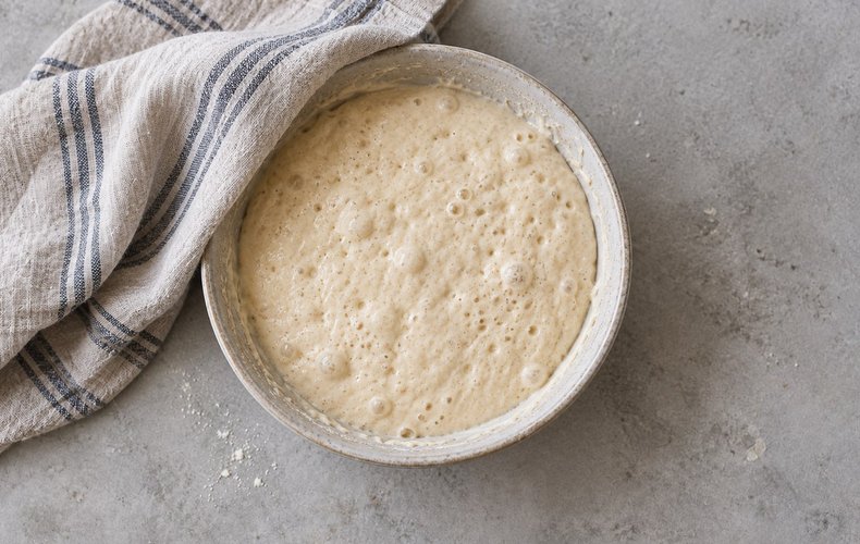 Salt Cod Fritters, step 3: the batter risen and doubled in the covered bowl