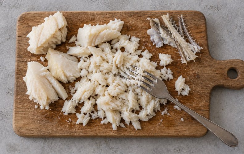 Salt Cod Fritters, step 4: boiled salt cod broken into small pieces