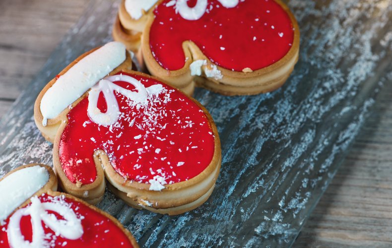 Mitten-shaped cookies decorated with red and white icing
