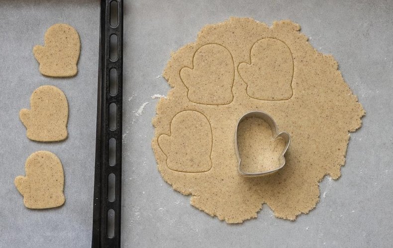 Santa's Mitten Cookies, step 4: mitten shapes cut out of the rolled dough