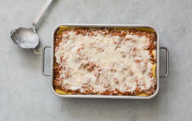 Sausage Ragù Lasagna, step 6: egg pasta sheets layered with sausage ragù, béchamel and grated Grana