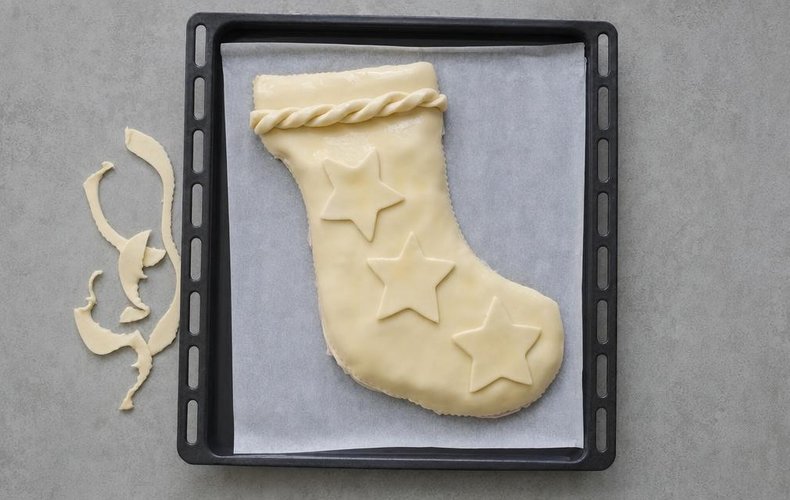 Savory Befana Stocking, step 5: pastry scrap decorations pressed onto the stocking
