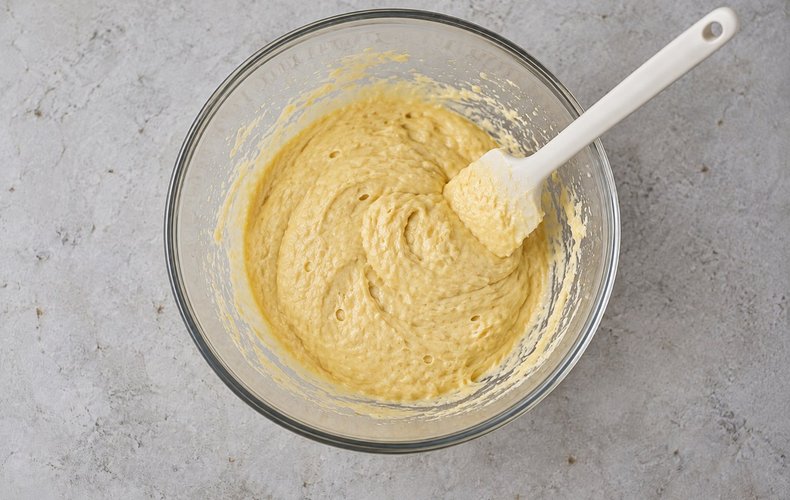 Savory Christmas Tree, step 3: flour and leavening mixed into the batter with a spatula