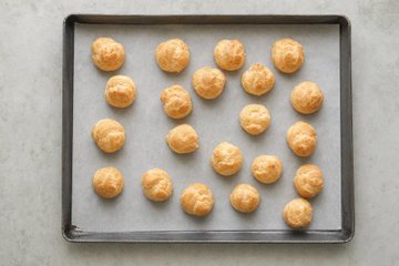 Savory Cream Puffs, step 2: cream puffs on a baking sheet lined with parchment paper