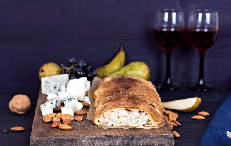 Golden baked puff pastry strudel with gorgonzola and pear filling