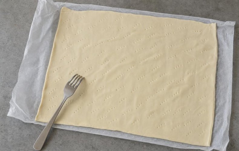 Savory Green Apple and Salmon Strudel, step 1: puff pastry unrolled and pricked with a fork