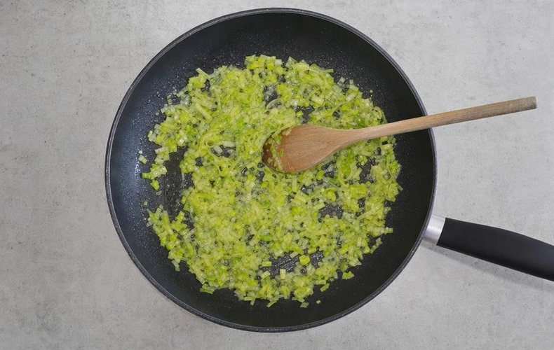 Savory Leek and Salmon Tartlets, step 1: chopped leek cooking in butter in a nonstick skillet
