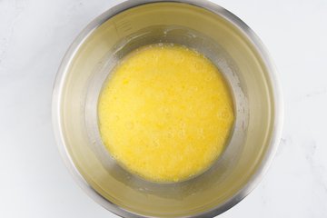 Adding the grated Parmigiano Reggiano