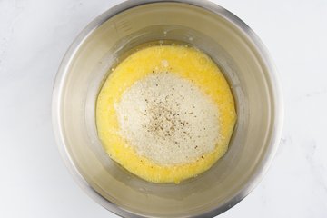 Seasoning the mixture with salt and pepper