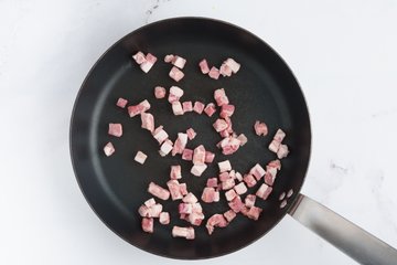 Browning the pancetta in a skillet