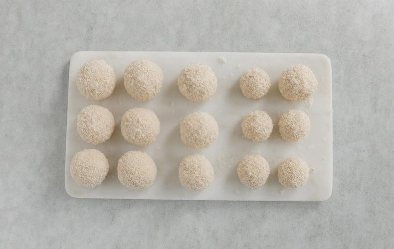 Shaping the tuna and cheese mixture into balls