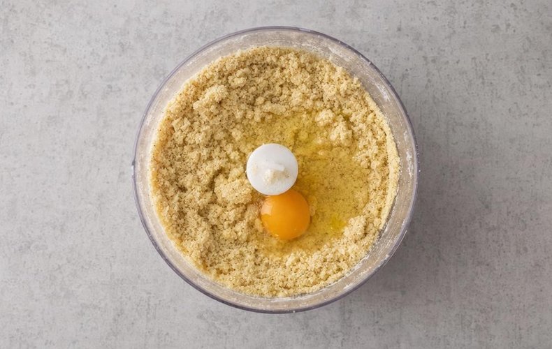 Shortcrust Pastry Befana Stocking, step 1: hazelnut shortcrust dough mixed in a food processor