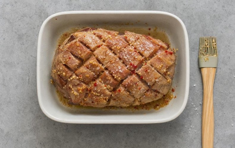 Slow-Roasted Pork Shoulder, step 3: pork shoulder turned and brushed again with the sauce