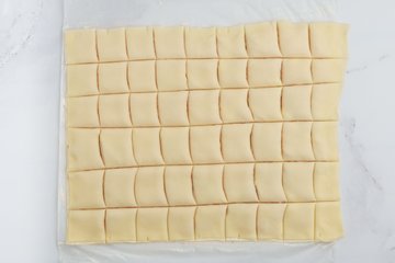 Brushing the surface with egg yolk and milk