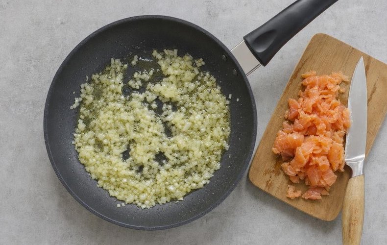 Smoked Salmon Risotto, step 1: chopped onion sautéing in oil and butter