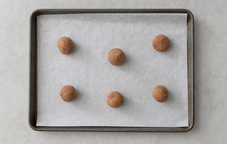 Snickerdoodle Cookies, step 7: the cookies on a baking sheet lined with parchment paper