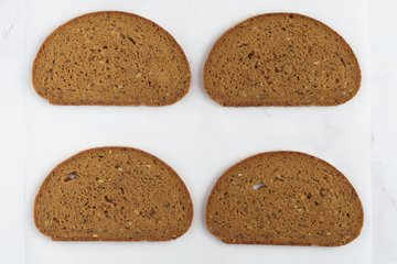 Cutting snowflakes from the bread slices