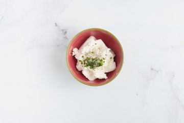 Mixing the goat cheese with salt, pepper and chives