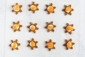 Topping the crostini with smoked salmon