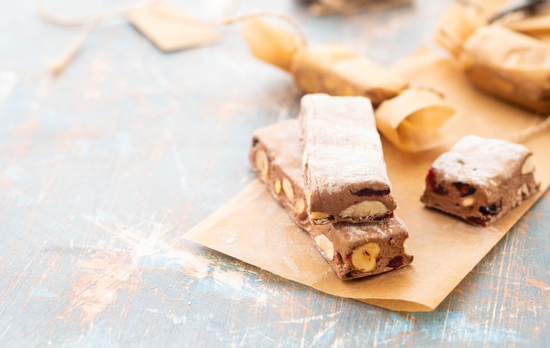 Soft chocolate torrone with hazelnuts, almonds and pistachios