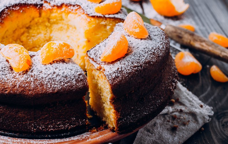 Soft mandarin ring cake dusted with powdered sugar