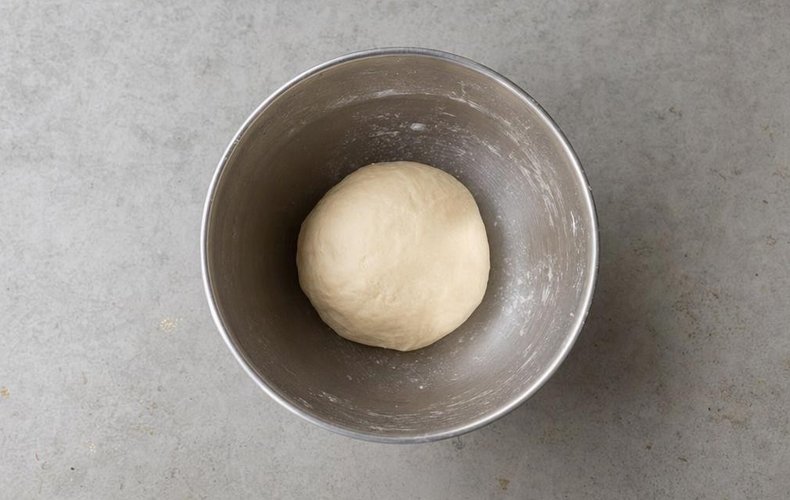 Apple Strudel, step 1: kneading the dough with flour, egg, oil and water