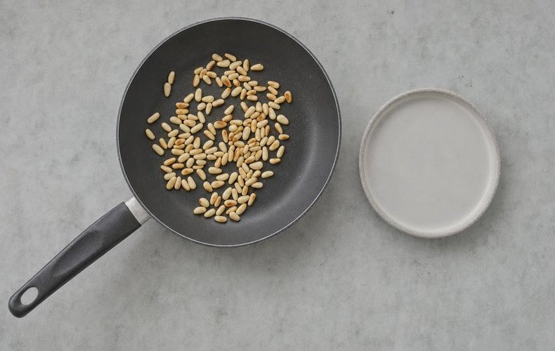 Apple Strudel, step 6: toasting the pine nuts in a skillet