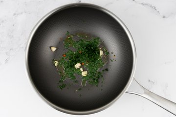 Chopped parsley, garlic, and chile sautéing in olive oil