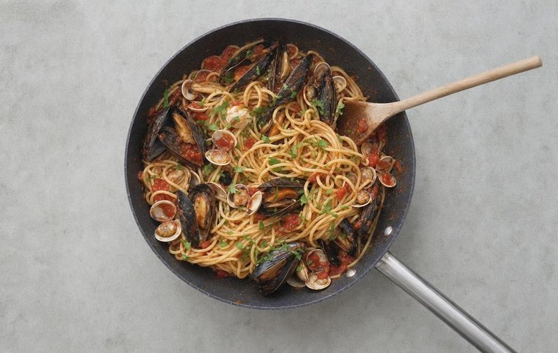 Spaghetti tossed in the mussel and clam sauce with chopped parsley