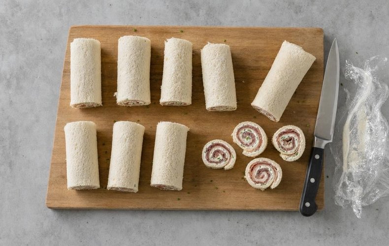 Slicing the chilled rolls into pinwheels