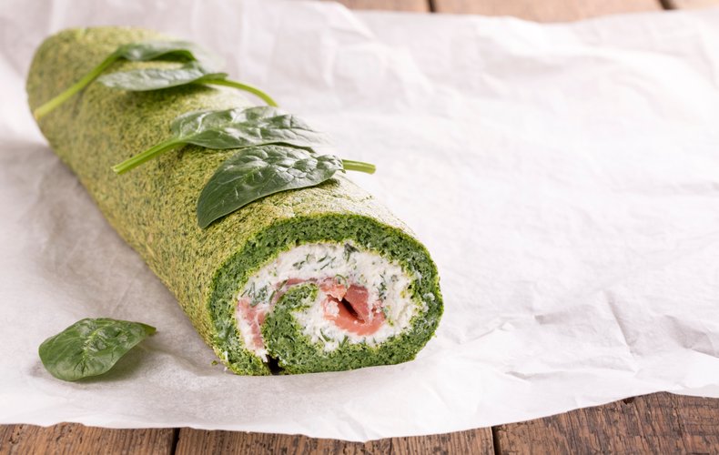 Slices of spinach and salmon roll