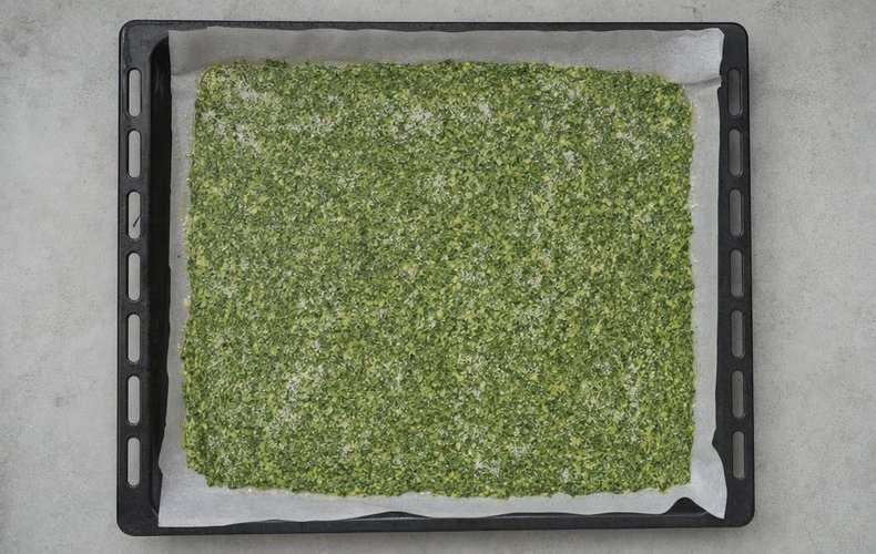 Spinach and Salmon Roll, step 2: the egg and spinach mixture in a lined baking pan