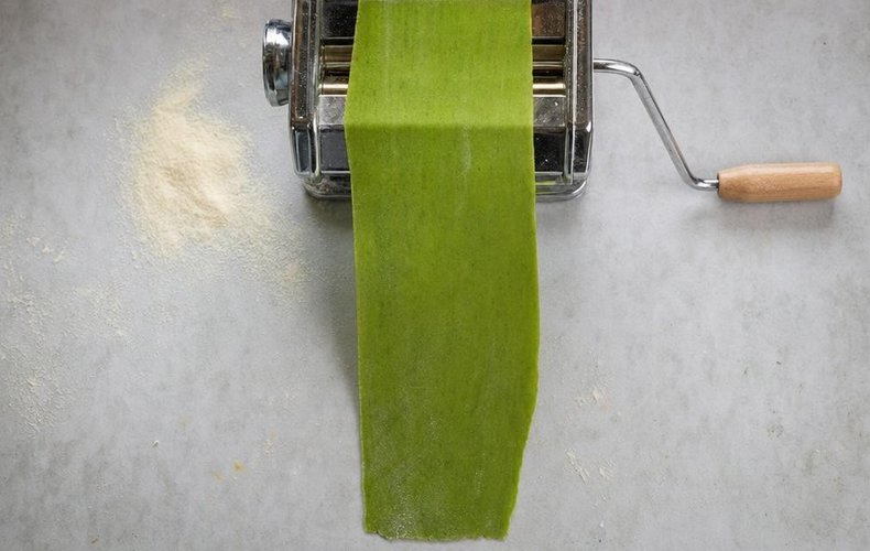 Spinach Tortelli with Ricotta and Parmigiano, step 4: green pasta dough rolled out with a pasta machine