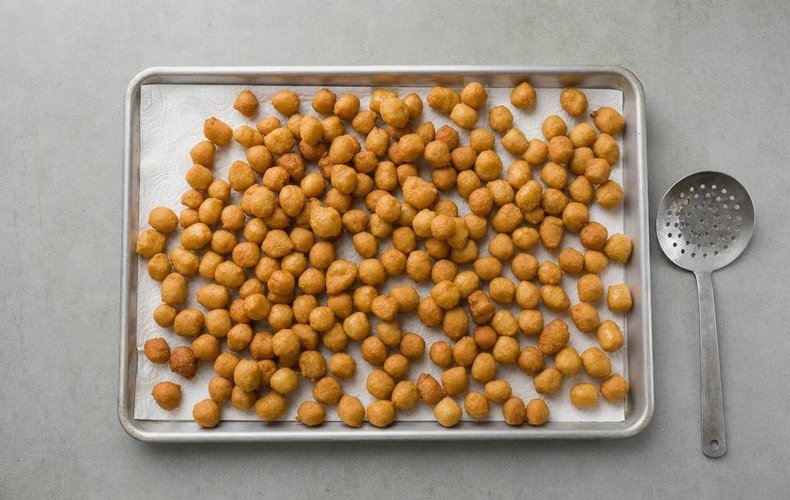 Struffoli, step 3: frying the struffoli in hot oil