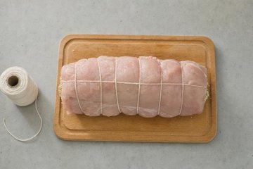 Stuffed Roast Turkey Roll, step 5: the turkey roll tied with kitchen twine