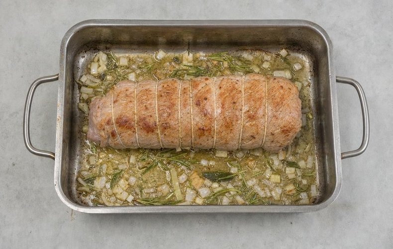 Stuffed Veal Roast, step 3: the roast browning in the pan with onion and herbs