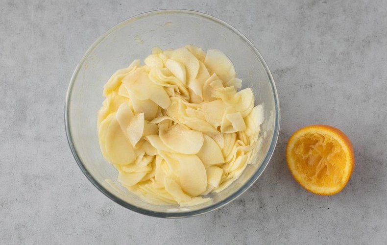 Thousand-Layer Apple and Almond Cake, step 3: thinly sliced apples tossed with orange juice