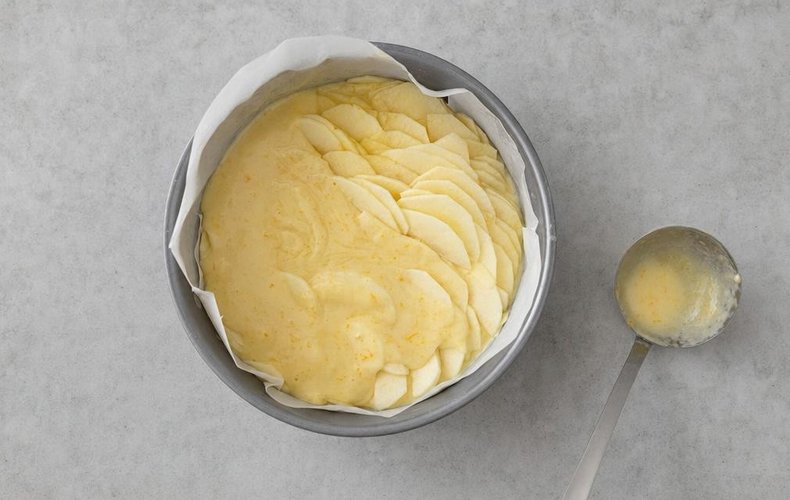 Thousand-Layer Apple and Almond Cake, step 4: layers of apple slices and batter in a lined cake pan