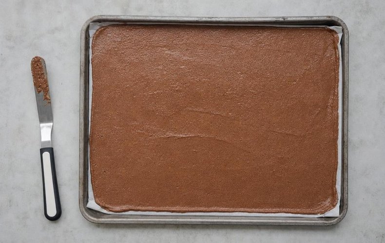 Tiramisu and Nutella Yule Log, step 3: the batter spread on a lined sheet pan