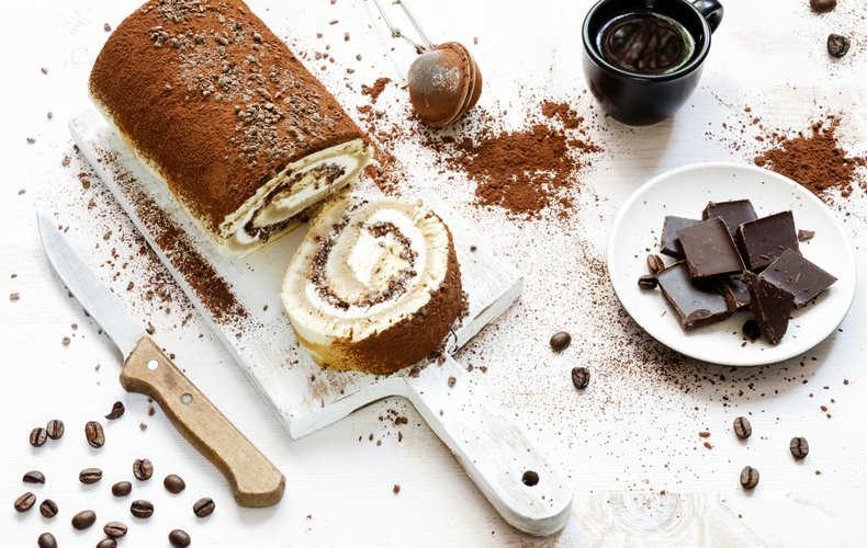 Tiramisù Roll Cake dusted with cocoa
