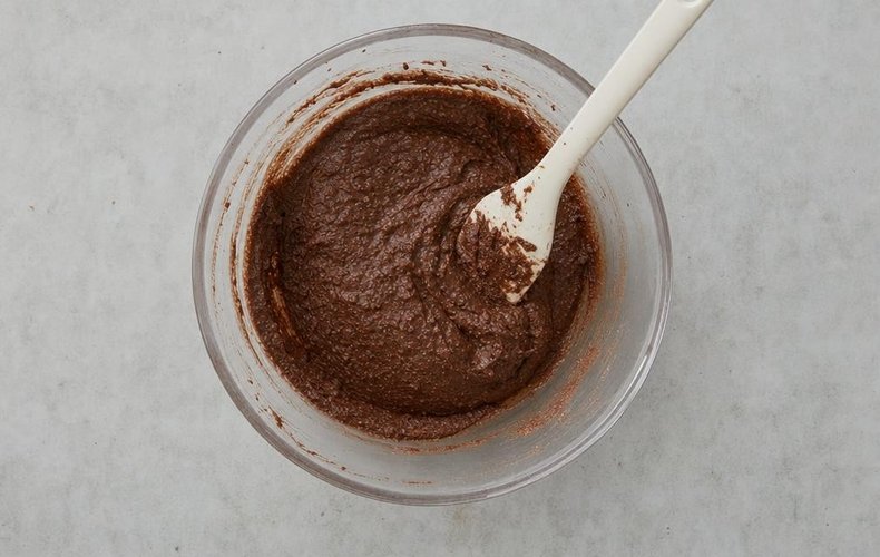 Torta Caprese, step 4: melted chocolate and ground almonds mixed into the yolks