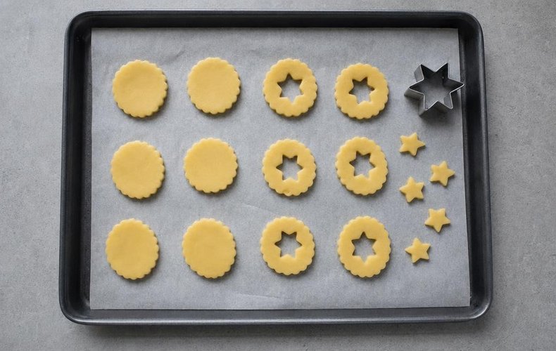 Tyrolean Jam Cookies, step 4: holes cut in the center of half of the cookies