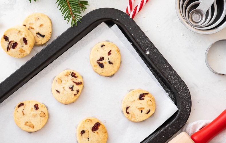 Walnut and blueberry cookies on a baking sheet