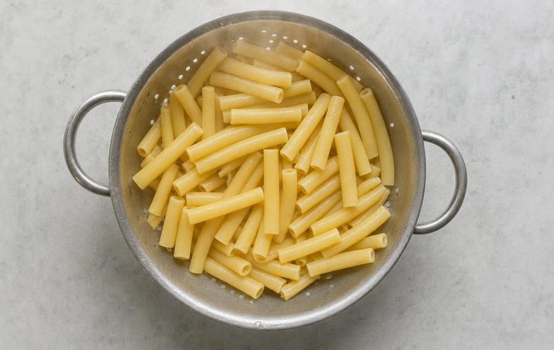 Ziti Lasagna, step 3: the boiled ziti tossed with a drizzle of oil